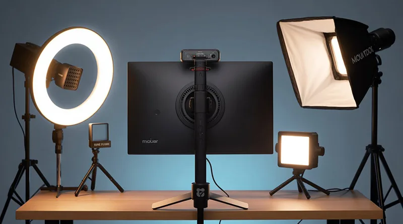 A guide to the best lighting for streaming, featuring a key light, ring light, and panel light positioned around a streaming setup.