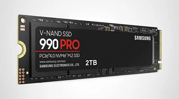 The Samsung 980 Pro, the best overall NVMe SSD for gaming, being installed into a motherboard's M.2 slot.