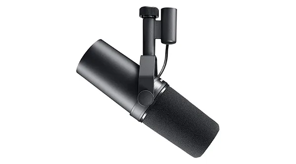 The iconic Shure SM7B, the professional industry standard XLR microphone for studio-grade vocals, mounted on a boom arm.