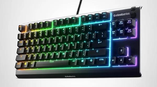 The SteelSeries Apex 3 TKL, the best overall mechanical gaming keyboard under $100, showing its brilliant RGB lighting.