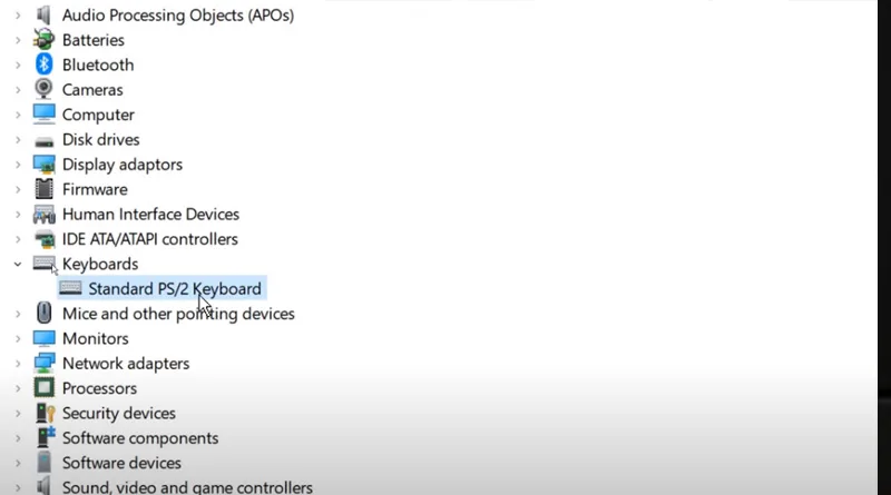 A screenshot of the Windows Device Manager, showing the user right-clicking a keyboard to select 'Update driver' to fix a wireless keyboard not working.
