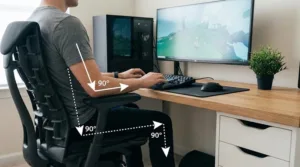 A clean, minimalist desk showing the correct ergonomic angles for the ultimate healthy gaming setup following the 90/90/90 rule.